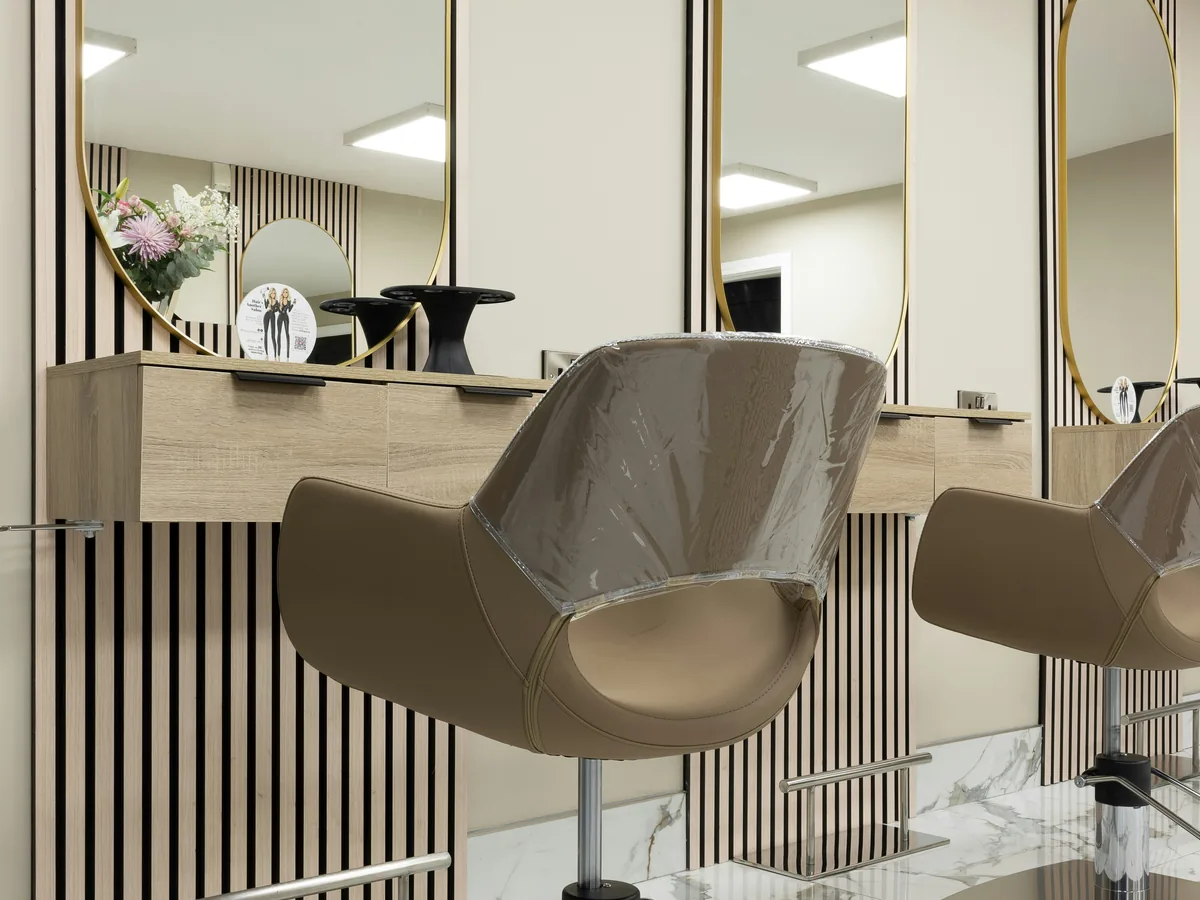 AI-generated hair lounge interior, not Ash's actual premises